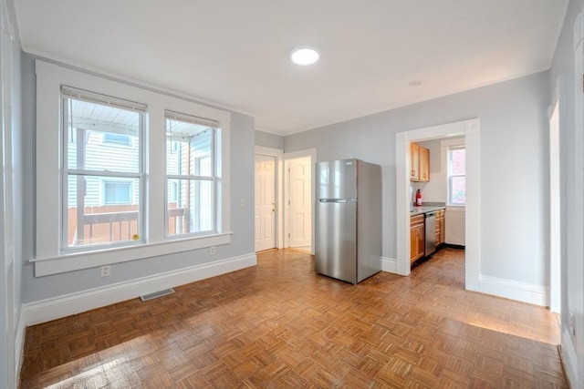 36 3rd St, Lowell, MA 01850 - kitchen with appliances with stainless steel finishes and baseboards
