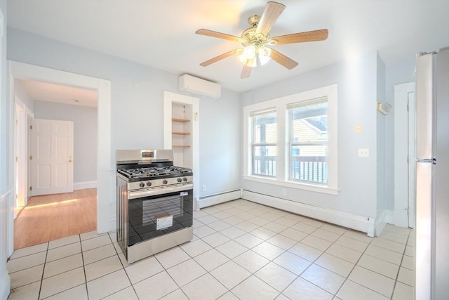 36 3rd St, Lowell, MA 01850 - kitchen featuring stainless steel range with gas stovetop, a wall unit AC, baseboard heating, a ceiling fan, and light tile patterned floors