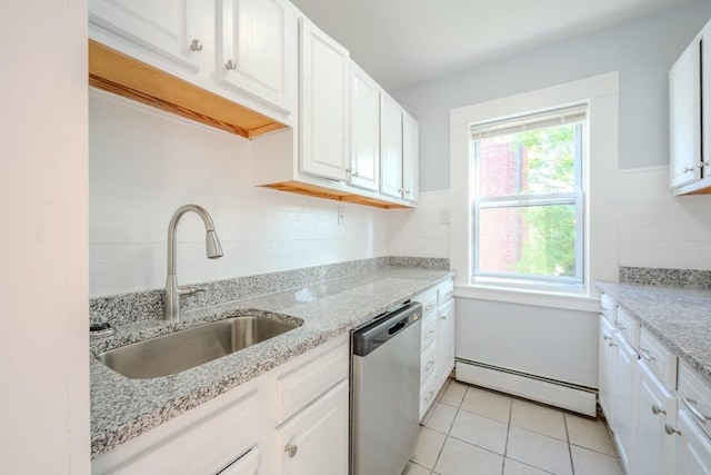 36 3rd St, Lowell, MA 01850 - kitchen with stainless steel dishwasher, a baseboard radiator, white cabinets, backsplash, and light tile patterned flooring
