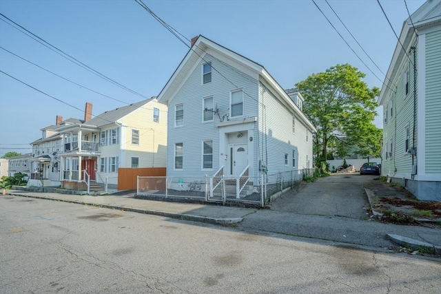 36 3rd St, Lowell, MA 01850 - multi unit property featuring entry steps, a residential view, and driveway