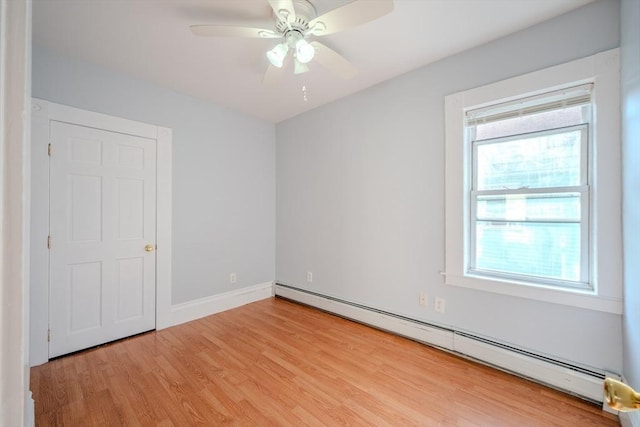 36 3rd St, Lowell, MA 01850 - unfurnished room with baseboard heating, light wood finished floors, and ceiling fan