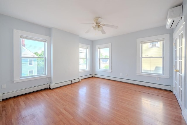 36 3rd St, Lowell, MA 01850 - unfurnished room with a wall unit AC, a baseboard radiator, light wood finished floors, and ceiling fan