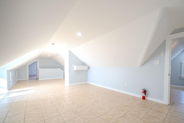 36 3rd St, Lowell, MA 01850 - additional living space with lofted ceiling, light tile patterned flooring, and recessed lighting