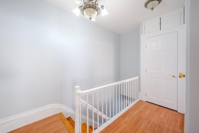 36 3rd St, Lowell, MA 01850 - hallway featuring light wood-type flooring and an upstairs landing