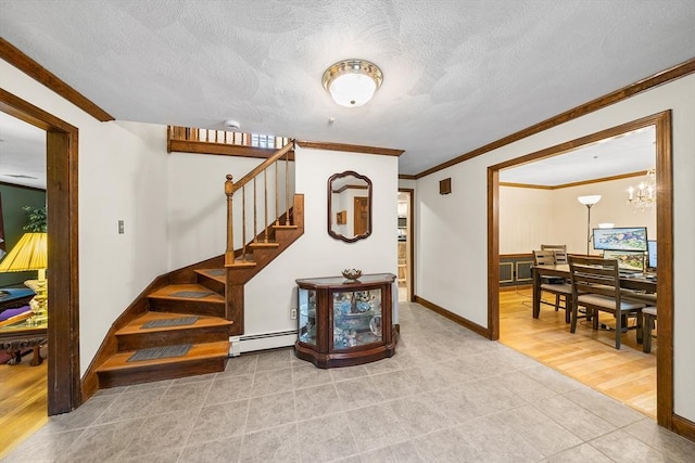 89 Gray St, North Andover, MA 01845 - stairway featuring a baseboard heating unit, crown molding, tile patterned floors, a chandelier, and a textured ceiling