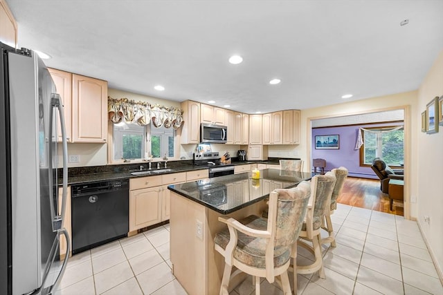89 Gray St, North Andover, MA 01845 - kitchen with appliances with stainless steel finishes, healthy amount of natural light, light tile patterned floors, a center island, and recessed lighting