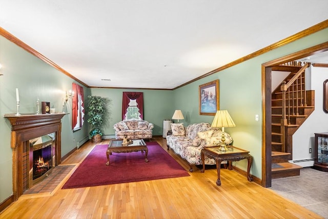 89 Gray St, North Andover, MA 01845 - living area with stairway, wood finished floors, ornamental molding, a warm lit fireplace, and baseboard heating