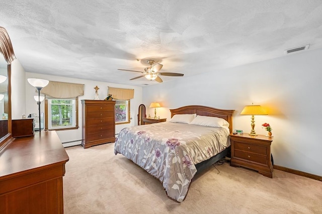 89 Gray St, North Andover, MA 01845 - bedroom with a baseboard radiator, light colored carpet, and ceiling fan