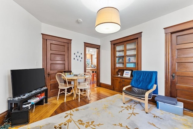 interior space with light wood-style floors and baseboards