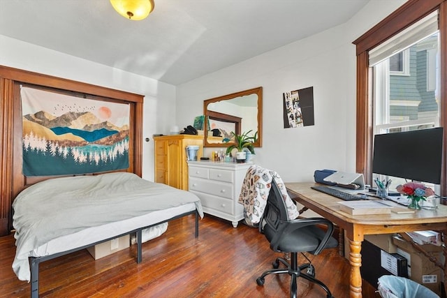 bedroom with wood finished floors