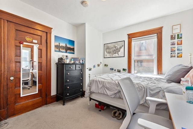 bedroom with light carpet