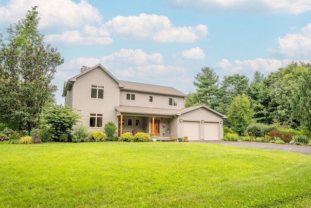 view of front facade with a front yard, a garage, and a porch