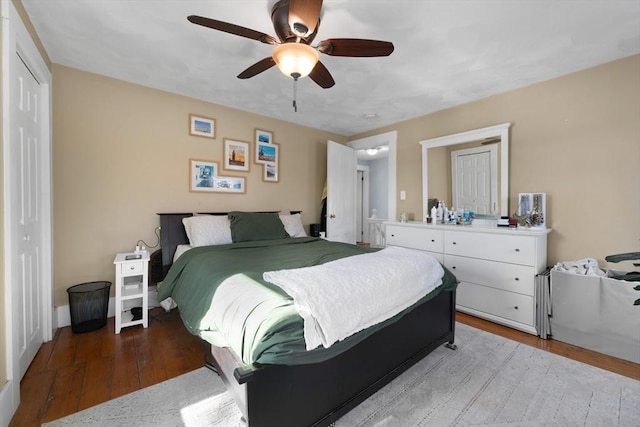 bedroom featuring ceiling fan, a closet, and light hardwood / wood-style flooring