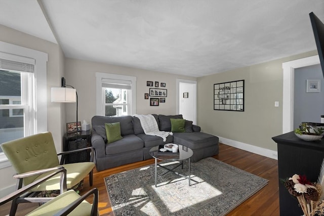 living room featuring dark wood-type flooring