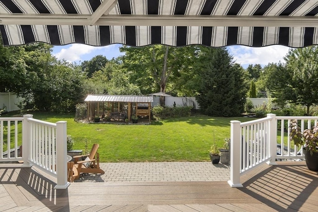 view of yard featuring fence and a deck