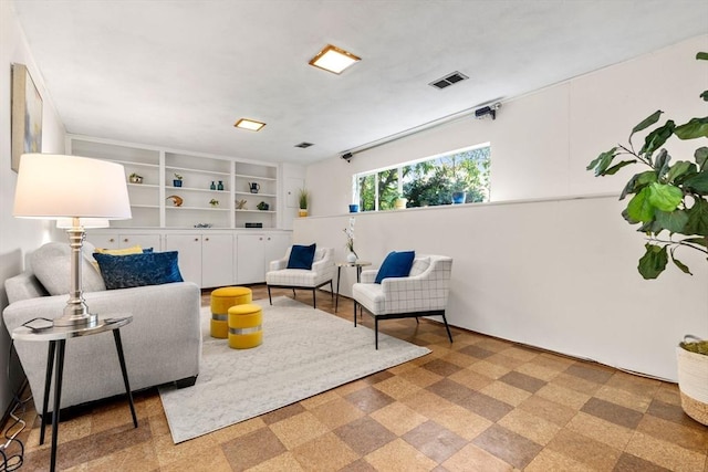 living area featuring visible vents