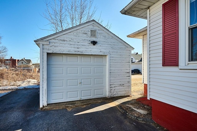 detached garage featuring driveway