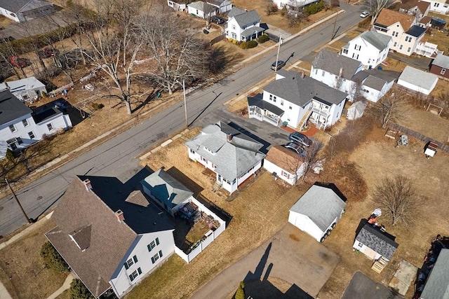 birds eye view of property with a residential view