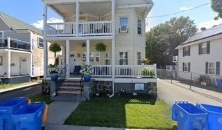 view of front of home featuring covered porch and a balcony