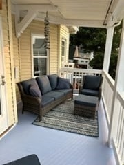 exterior space featuring outdoor lounge area and covered porch