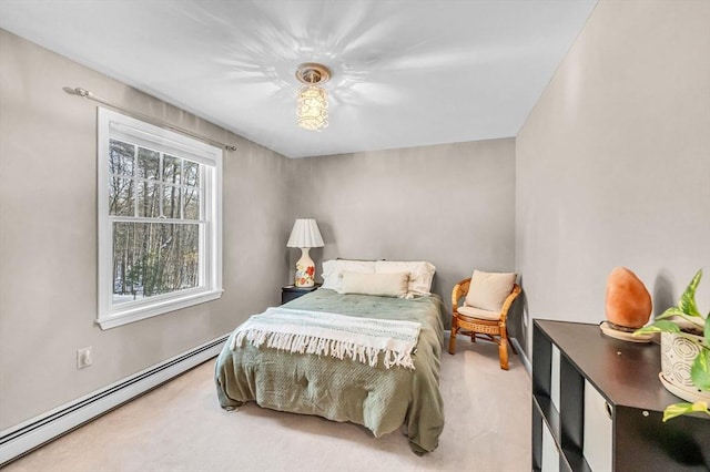 carpeted bedroom with a baseboard radiator