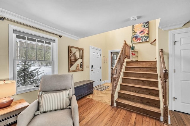 interior space featuring crown molding and baseboard heating