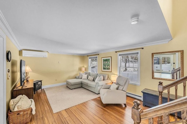 living room featuring a wall mounted air conditioner, crown molding, a baseboard radiator, and light wood-type flooring