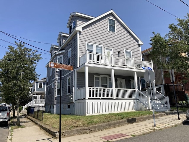 view of front of house featuring a balcony and a porch