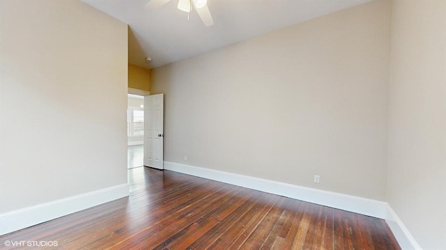 spare room featuring dark hardwood / wood-style floors and ceiling fan