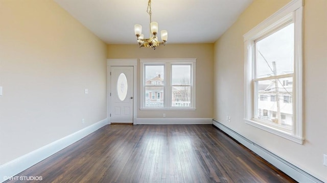 foyer featuring a notable chandelier, dark wood-type flooring, and a baseboard radiator