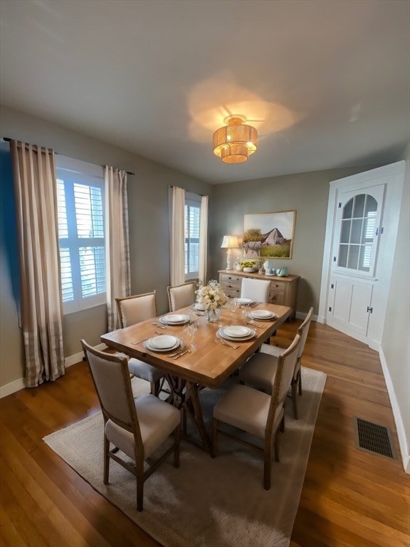 dining space featuring dark hardwood / wood-style floors