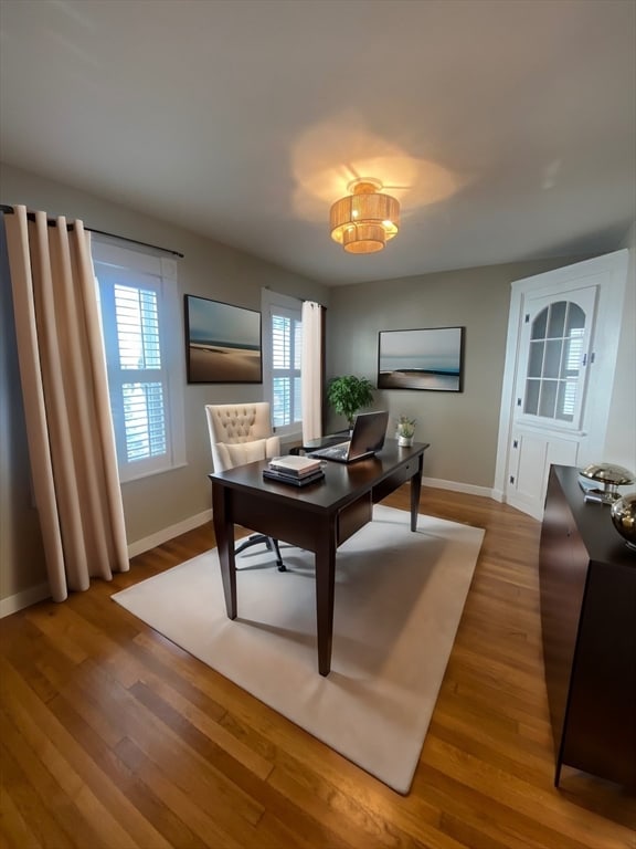 dining area with hardwood / wood-style floors