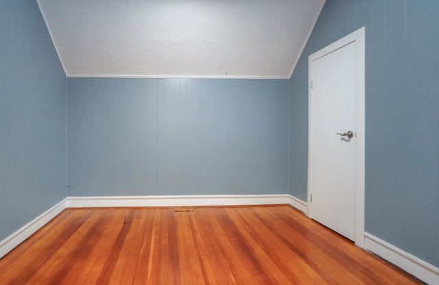 bonus room featuring lofted ceiling and light hardwood / wood-style floors