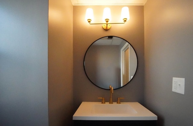 bathroom with vanity and ornamental molding