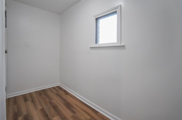 spare room with dark hardwood / wood-style flooring