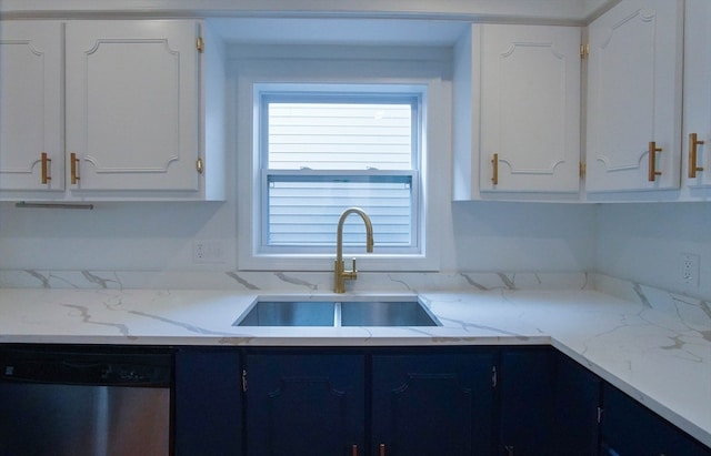 kitchen featuring light stone counters, dishwasher, sink, and white cabinets