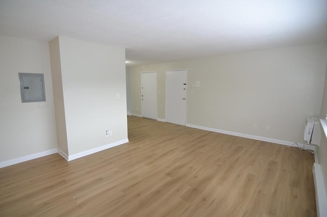 77 Nicholas Rd Unit I, Framingham, MA 01701 - spare room with electric panel, light wood-style flooring, and baseboards