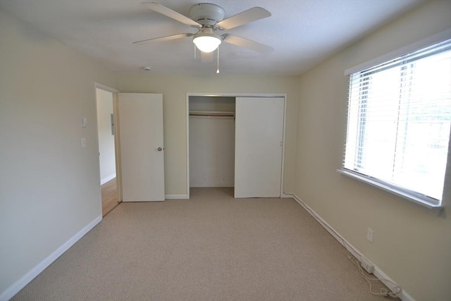 77 Nicholas Rd Unit I, Framingham, MA 01701 - unfurnished bedroom featuring multiple windows, a closet, light colored carpet, and baseboards