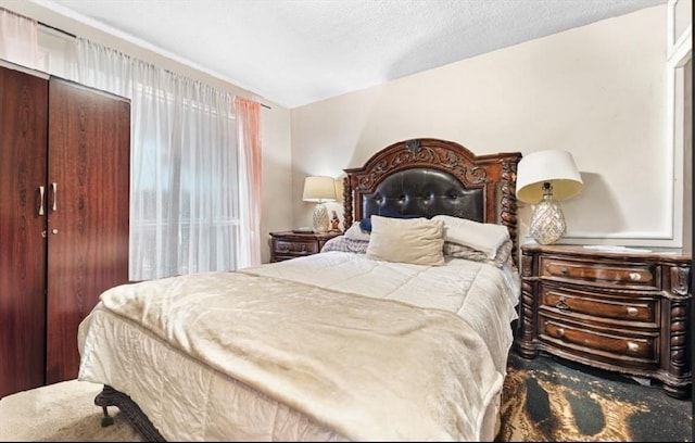 bedroom featuring a closet and a textured ceiling