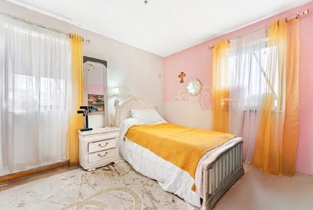 bedroom featuring light colored carpet