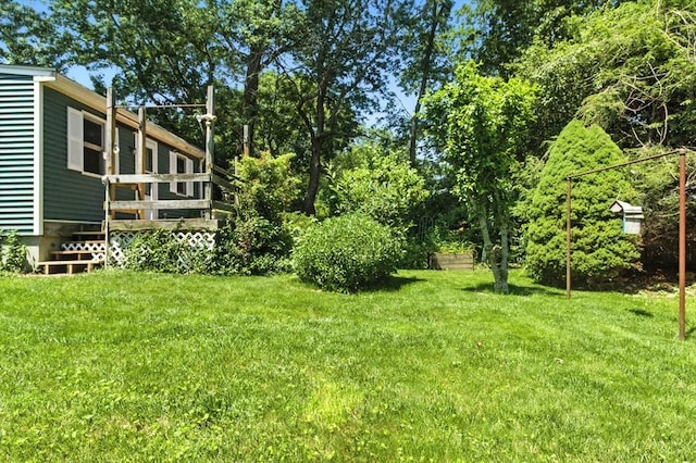 14 Doris Dr, Abington, MA 02351 - view of grassy yard featuring a deck