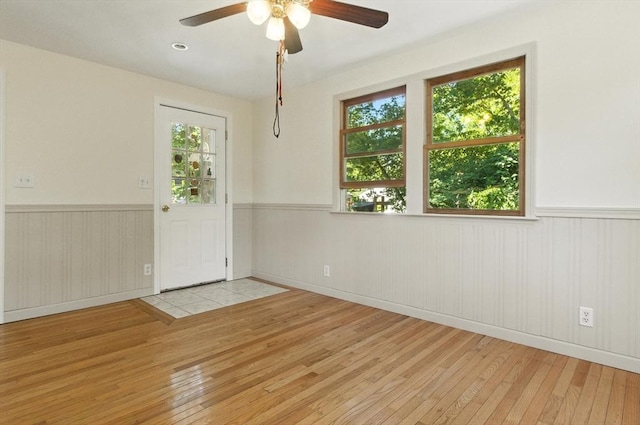 14 Doris Dr, Abington, MA 02351 - unfurnished room featuring wood-type flooring, wainscoting, ceiling fan, and healthy amount of natural light