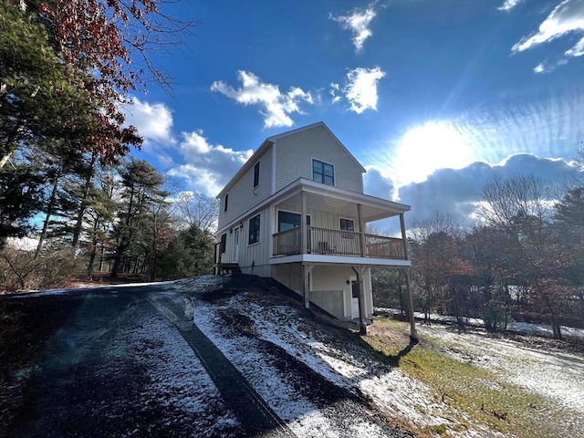 view of side of property with a balcony