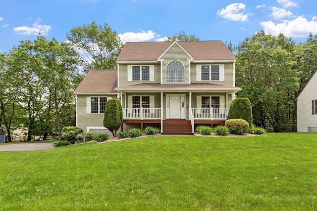 65 Saint Anthony St, Fitchburg, MA 01420 - colonial inspired home with covered porch, a front lawn, and roof with shingles