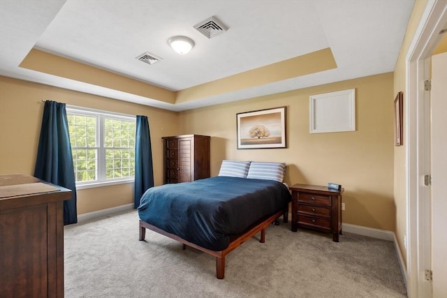 65 Saint Anthony St, Fitchburg, MA 01420 - bedroom featuring a raised ceiling, baseboards, and light colored carpet