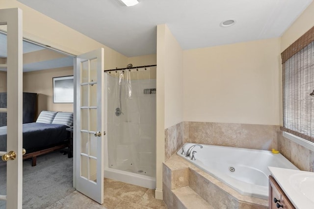 65 Saint Anthony St, Fitchburg, MA 01420 - ensuite bathroom with a whirlpool tub, a shower stall, and vanity