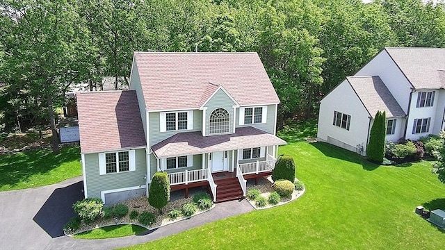 65 Saint Anthony St, Fitchburg, MA 01420 - view of front of house with a porch and a front yard