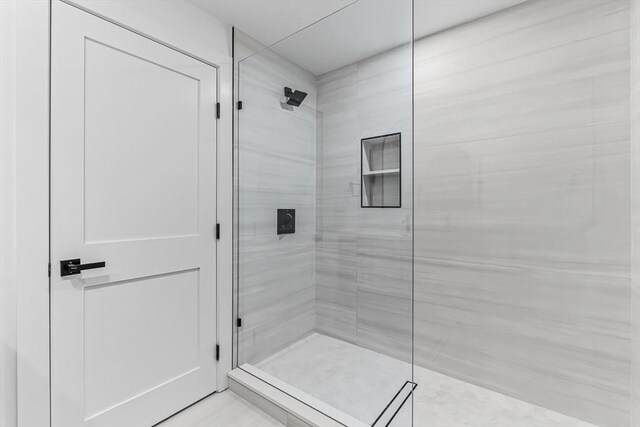 full bathroom with a shower stall and a sauna / steam room