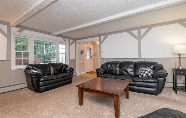 living room with baseboard heating, carpet floors, and a textured ceiling