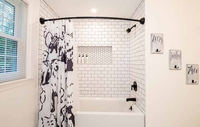 bathroom with shower / tub combo with curtain